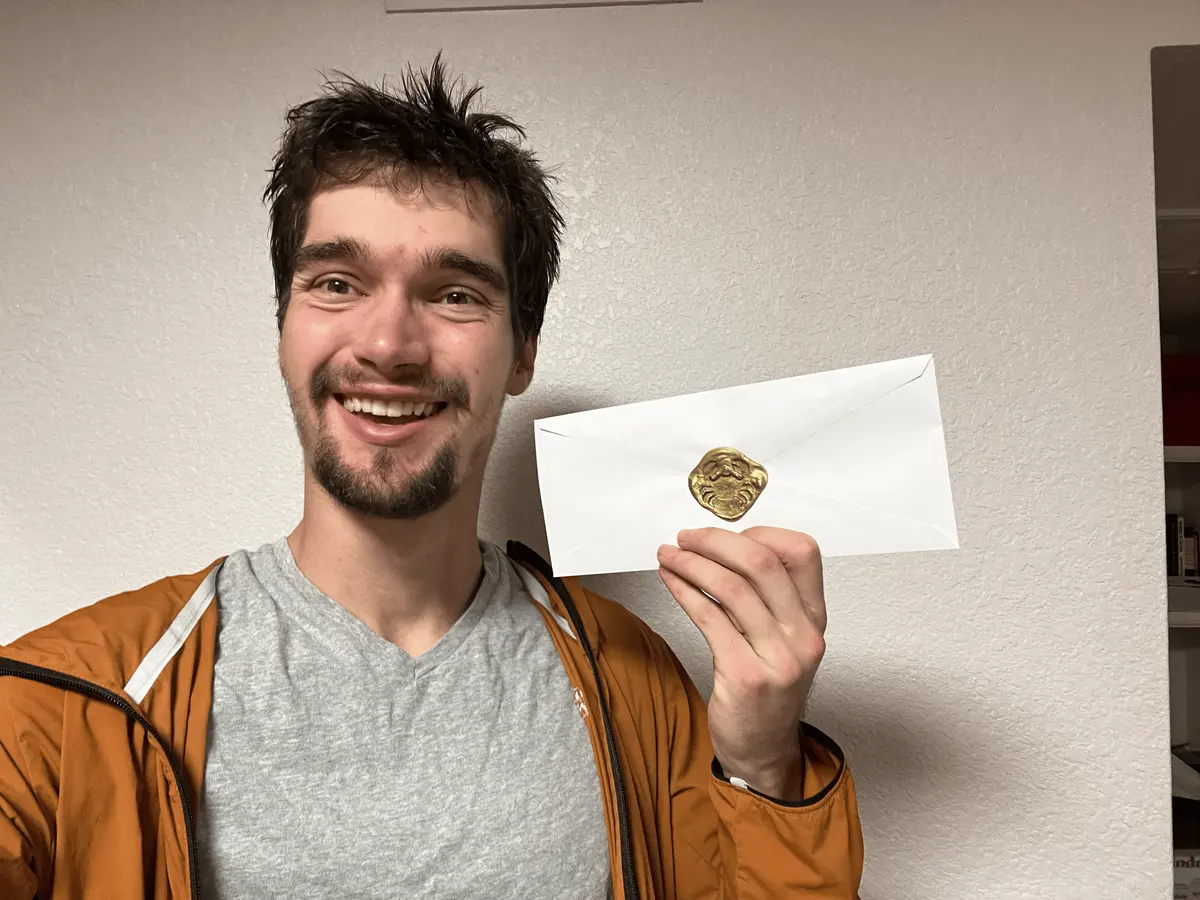 Wax Letter founder holding a custom wax sealed letter